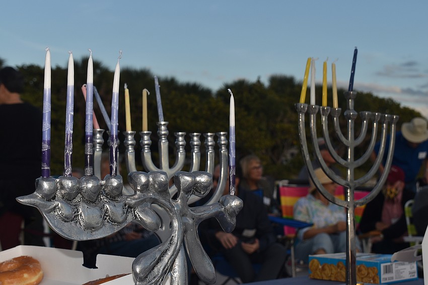 There were three menorahs, one for each host of the event.