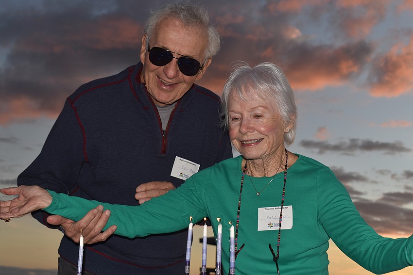 Irv and Doris Ross successfully got one of the menorahs lit.