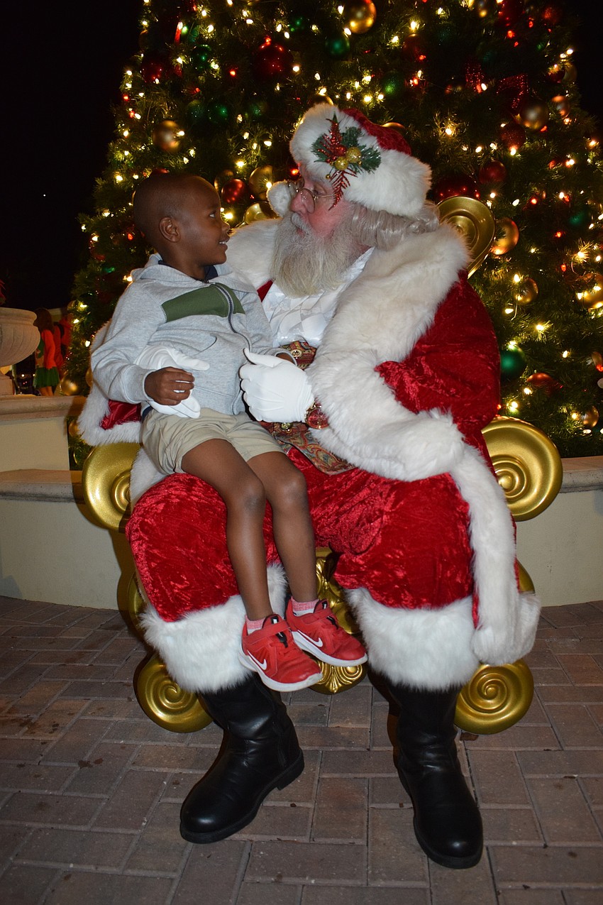 Lakewood Ranch's Brandon Johnson, who is 4 years old, talks to Santa.