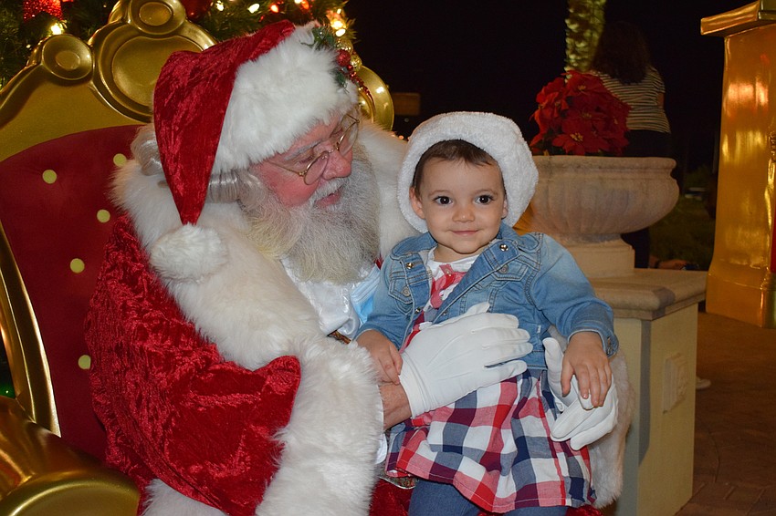 Greenbrook's Erin Viaud, who is 2 years old, is all smiles when visiting Santa for the first time.