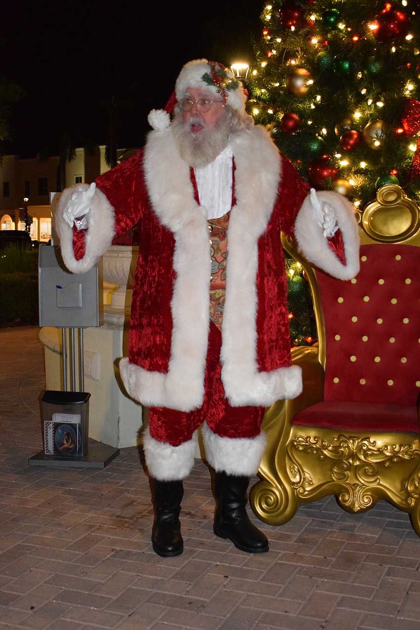 Santa welcomes families to Main Street at Lakewood Ranch before sitting in a big red chair to hear what children want for Christmas.