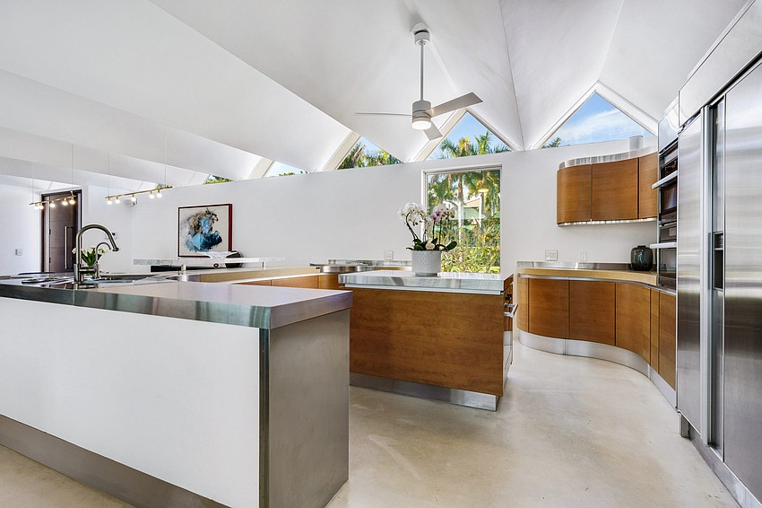 The home offers Miele and Viking appliances and Caesarstone surfaces in the kitchen.