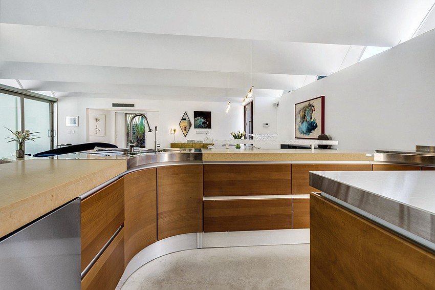 The home offers Miele and Viking appliances and Caesarstone surfaces in the kitchen.