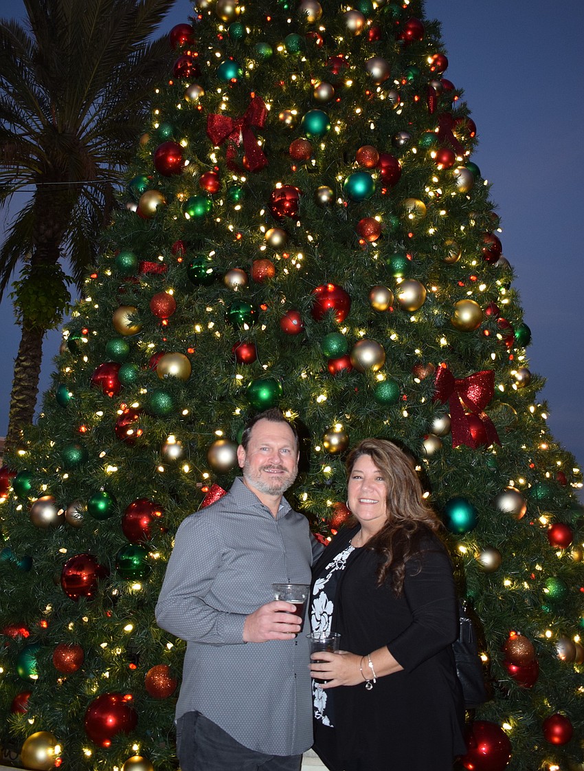 Mike Talerico and Annette Gueli enjoy the big Christmas tree at Main Street at Lakewood Ranch. The tree was lit just before Music on Main.
