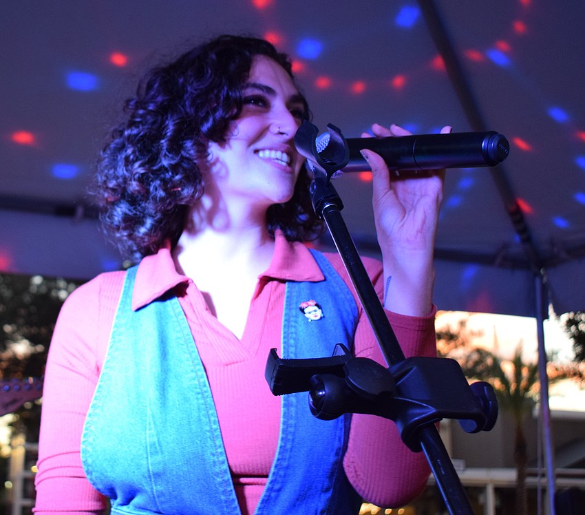 Briana Lutzi of Midnight Mama entertains the crowd at Music on Main.