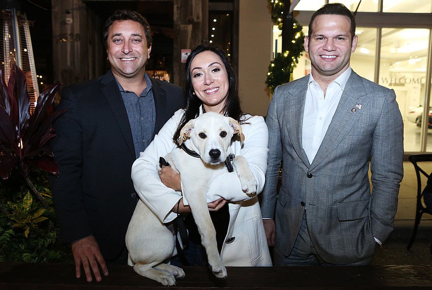 City commissioner Hagen Brody, Maryann Grgic, Rudy the dog and mayor Erik Arroyo