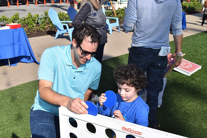 Lakewood Ranch resident Andrew Bunin plays a giant disc game with his 4 year-old son Jacob.