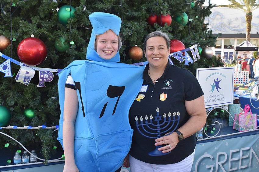 Gabrielle and Amy Meese get into the spirit at Hanukkah on the Green.