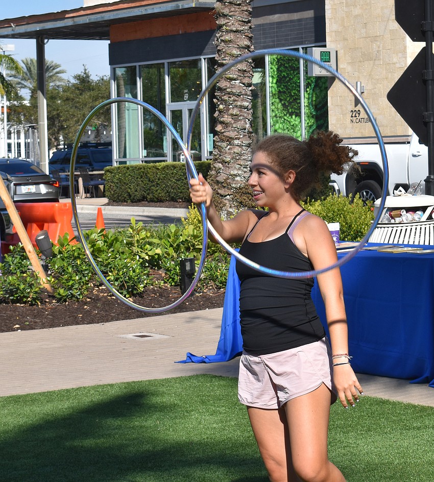 Claire Opal-Levine swings a pair of hoops to the delight of the crowd.