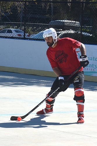 Joseph Constantin puts a shot on net during a Manatee Ball Hockey League game.