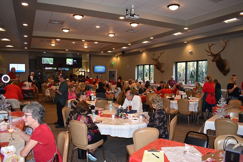 A crowd of more than 200 people donated shoeboxes and enjoyed their evening at the 16th annual Community Holiday Shoebox Drive and Reception at the Lakewood Ranch Elks Lodge Dec. 4.