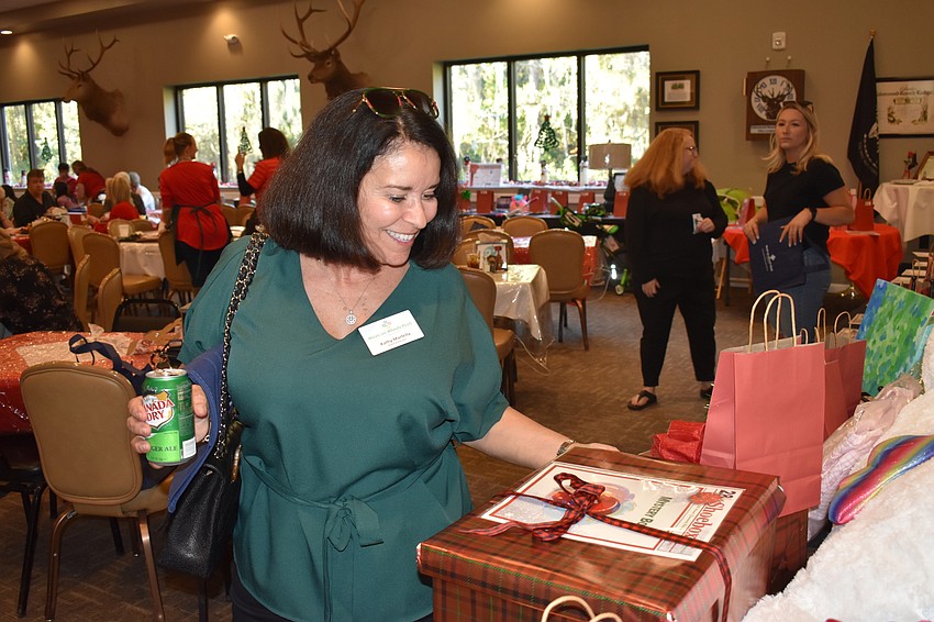 Kathy Martella checks out a pair of 