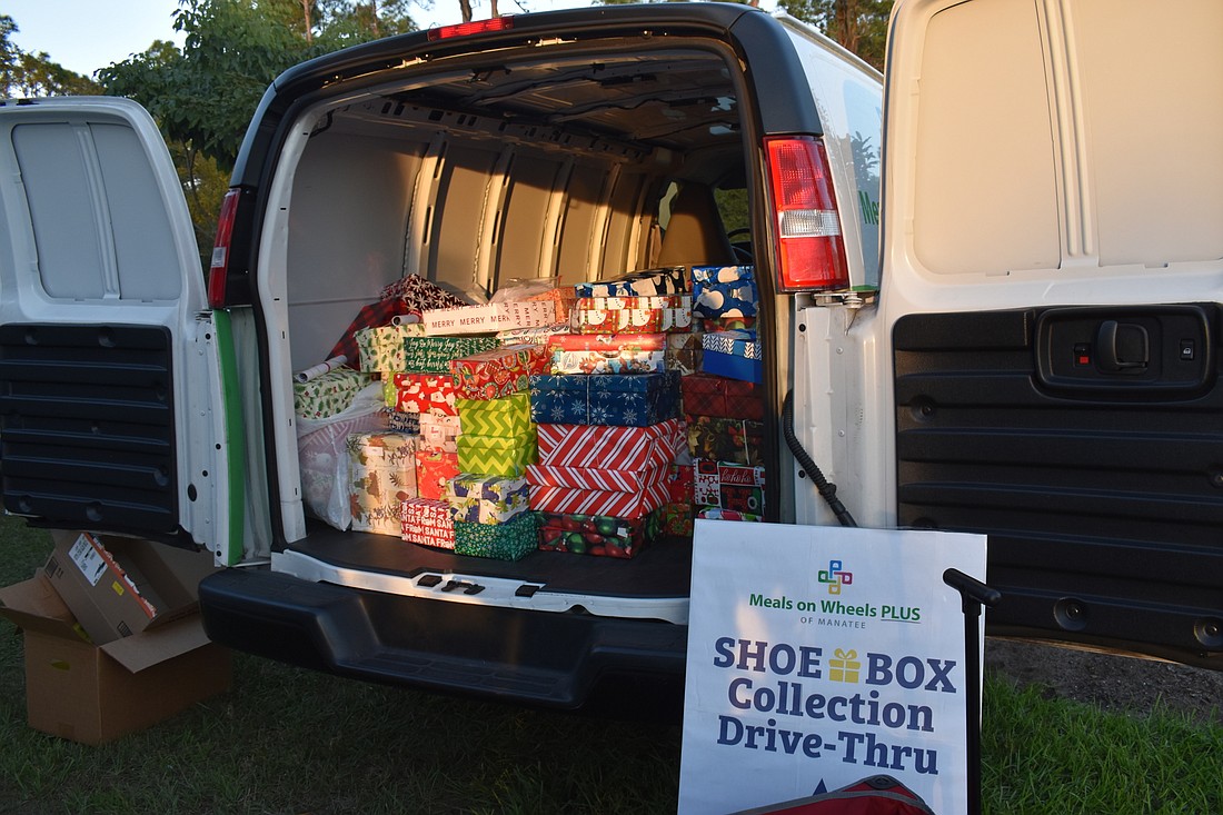 Nearly 500 donated shoeboxes fill one of two vans at the Holiday Shoebox Drive at the Lakewood Ranch Elks on Dec. 4, 2021.