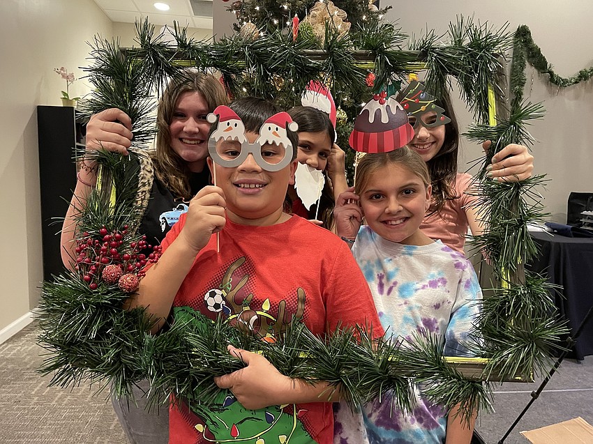 Grace Gerling, Landon Simphay, Lilly Gerling, Scarlet Knowles and Alexis Mariano have some fun in the selfie booth.