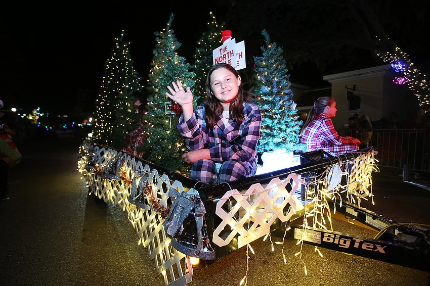 Laiken Slaydon sits among the trees with the  Foundations Christian Montessori Academy.