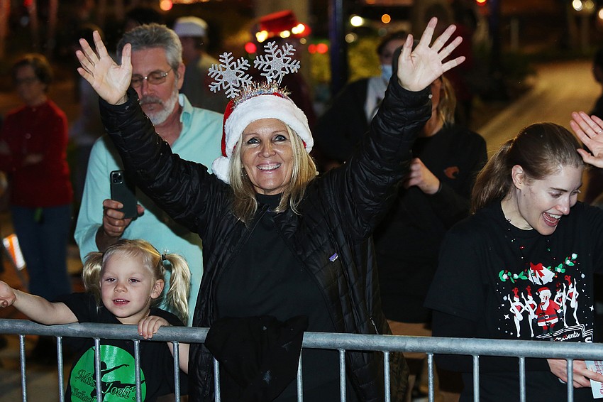 The parade was full of snow and cheering families.