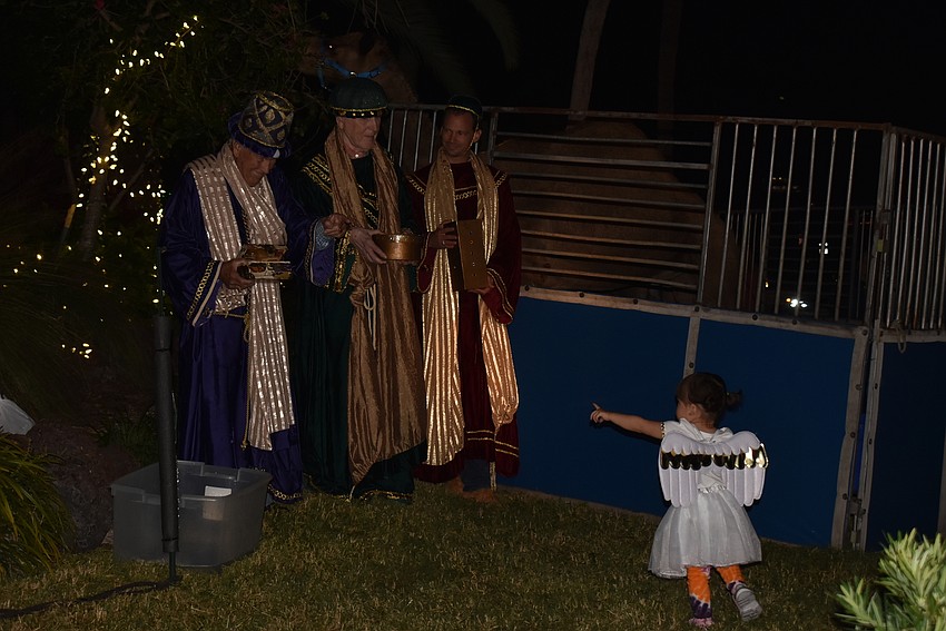 A tiny angel points out the wise men at the St. Armands Key Lutheran Church live nativity.