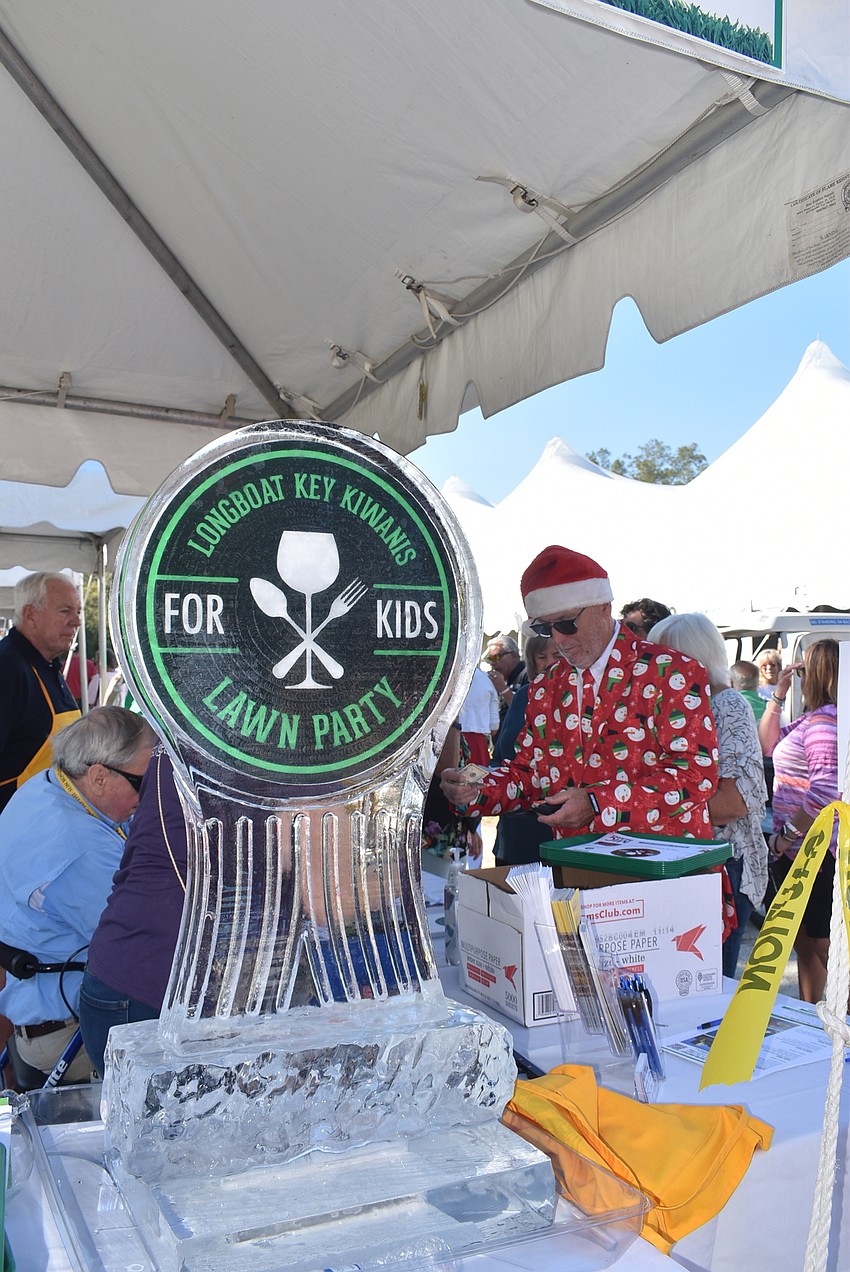 Attendees got their drink bracelets at the front. ofthe tent and made their way inside.