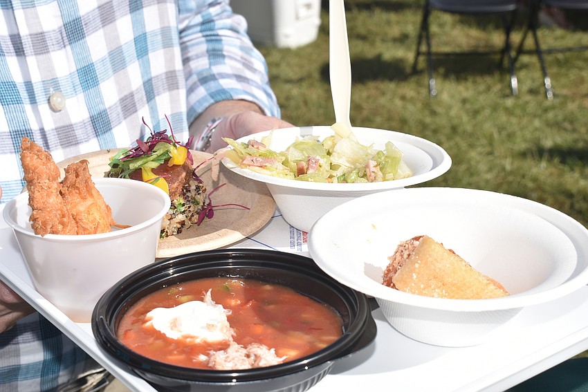 Attendees filled trays with food from the 22 restaurants.