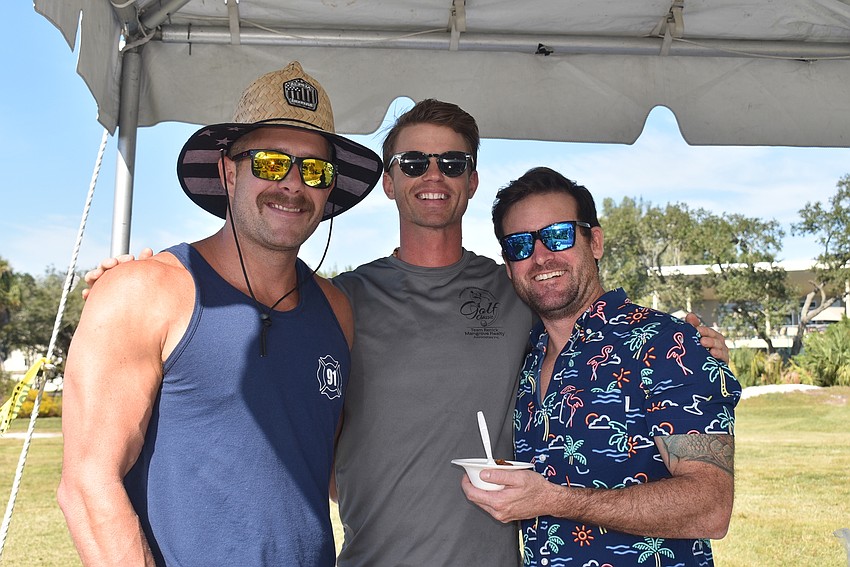 Zach Schield, Jamison Urch and Brian Kolesa served the Longboat Key Fire Department's chili.