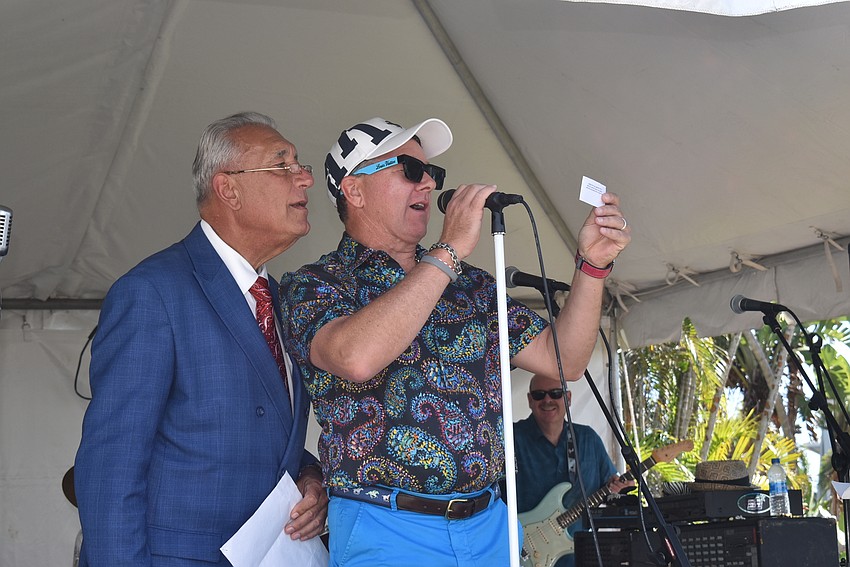 Chuck Wittall and Andrew Vac read out the grand prize winner.