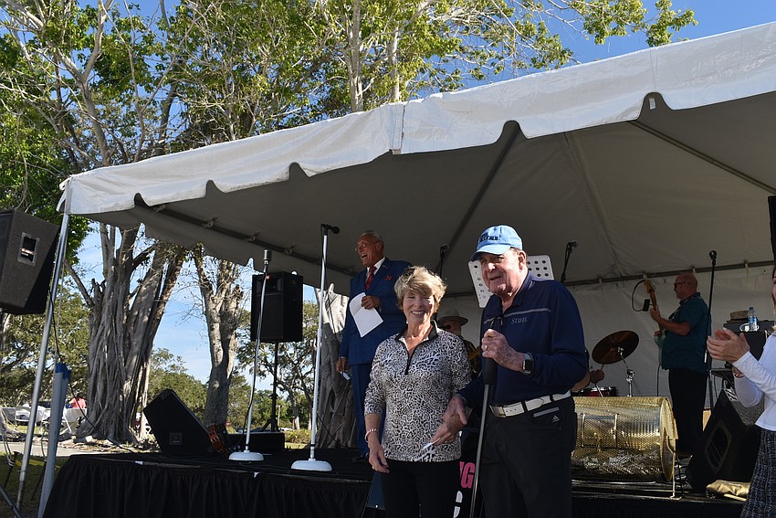 Sponsors Sue and Woody Wolverton drew the raffle winner for the Lobster Love package.