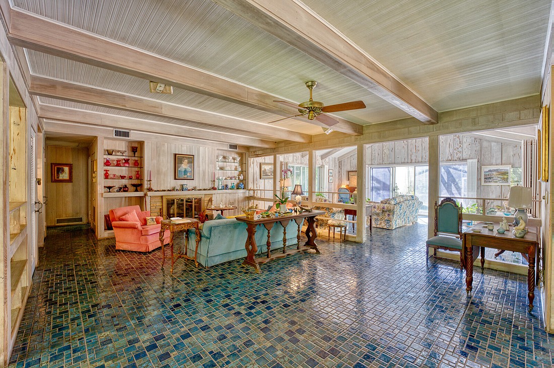 Mosaic tile floors are featured in the home.