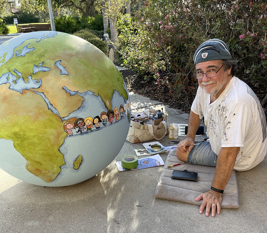SkipÂ  Dyrda painted the security bollards in the form of a globe.