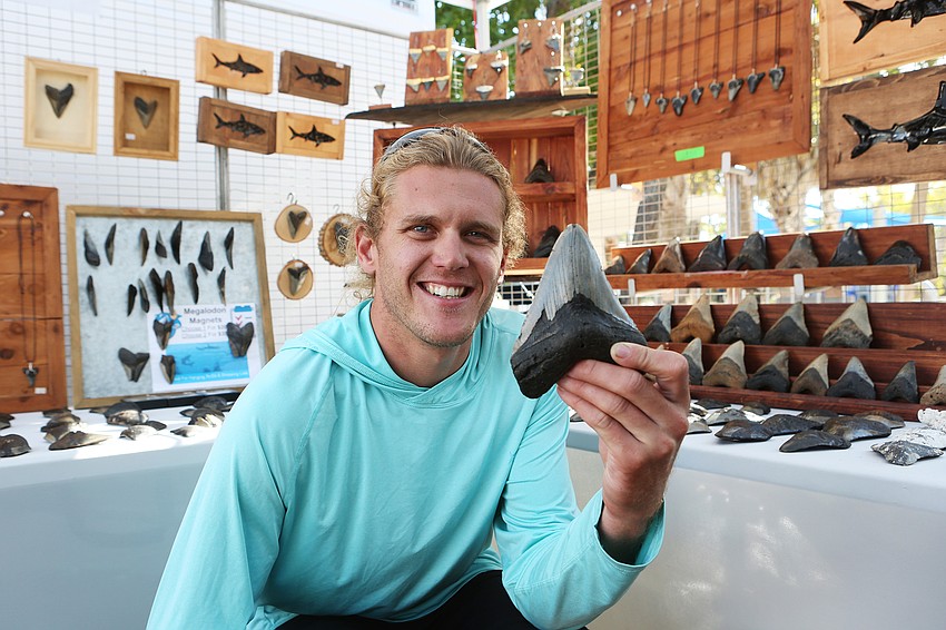 Zach DeWitt sells shark teeth he finds in the Atlantic Ocean.
