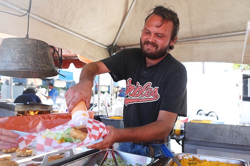 Josh Barber brings food to hungry guests.