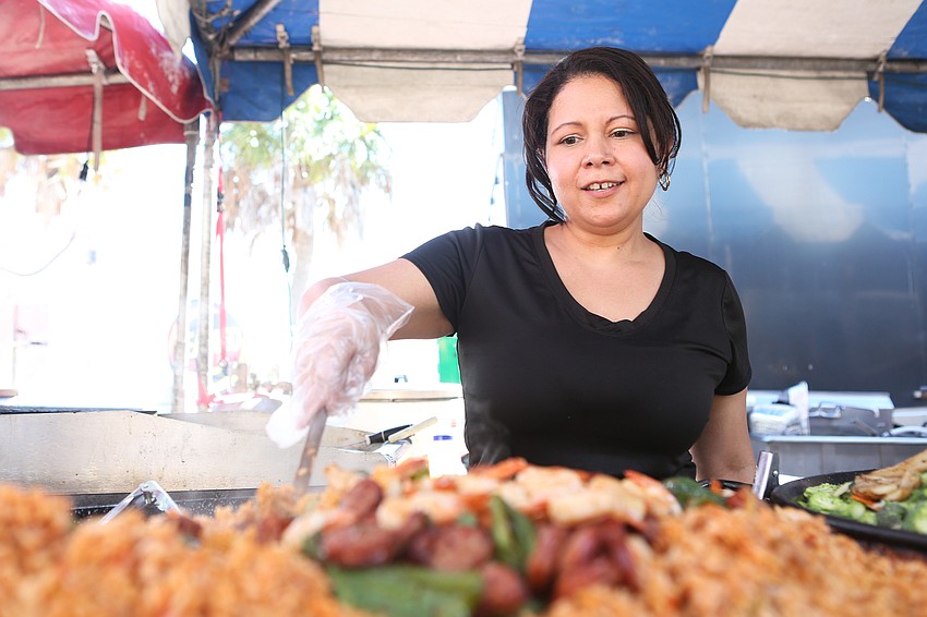 Lilian Prado tends to the seafood.