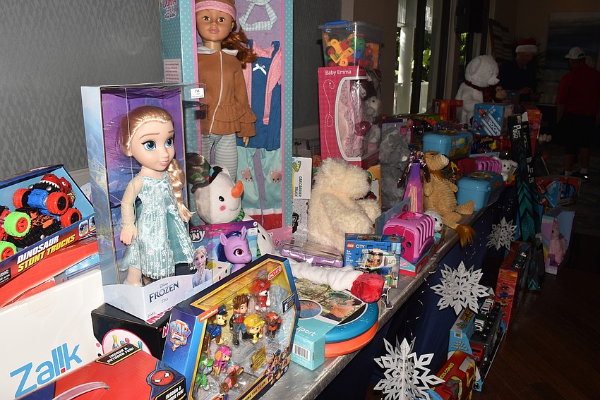 Members brought gifts to donate to Toys for Tots.