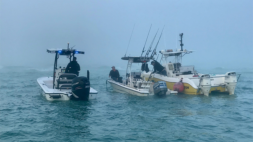 FEBRUARY: Police agencies from Sarasota and Longboat Key took part in the rescue of boaters from their sinking craft.