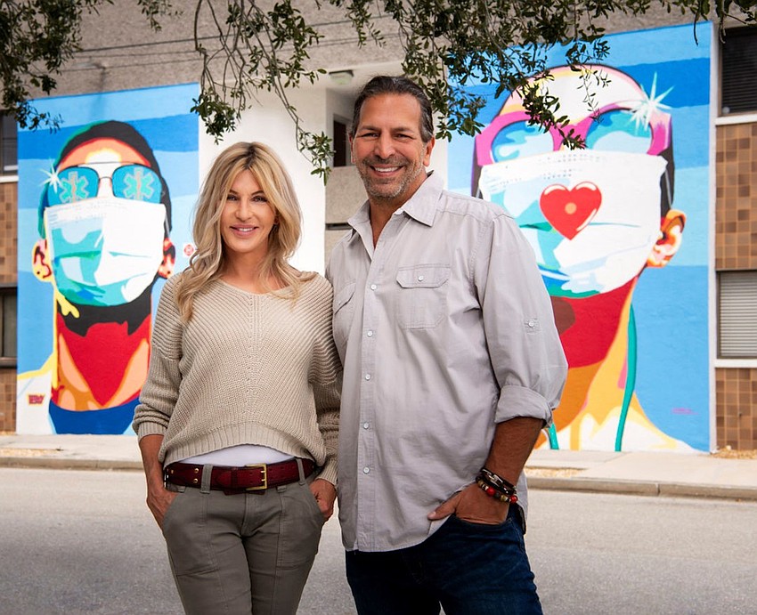FEBRUARY: Donda Mullis and Ronnie Shugar in front of their downtown Sarasota corporate headquarters. Courtesy photo.