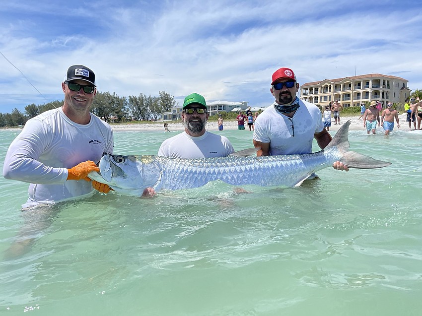 JUNE: Robert Cobb, Brad McCoy and Josh Maddox caught their first tarpon ever on June 3 off the beach in Longboat Key near the Positano condominiums.