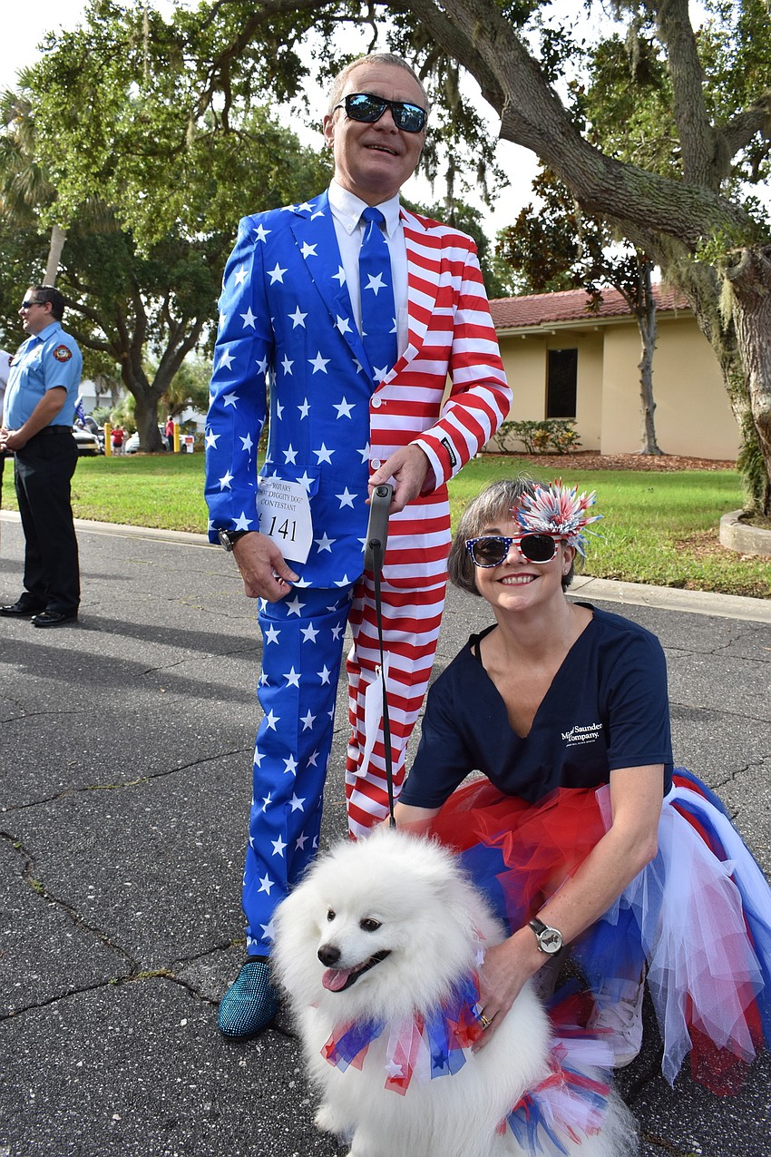 JULY: Ivan Gould and Sharon Gould pose for a picture with their dog Herbie.