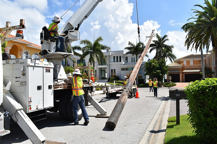 JULY: Volt Power Co. workers removed several light poles along Birdie Lane.