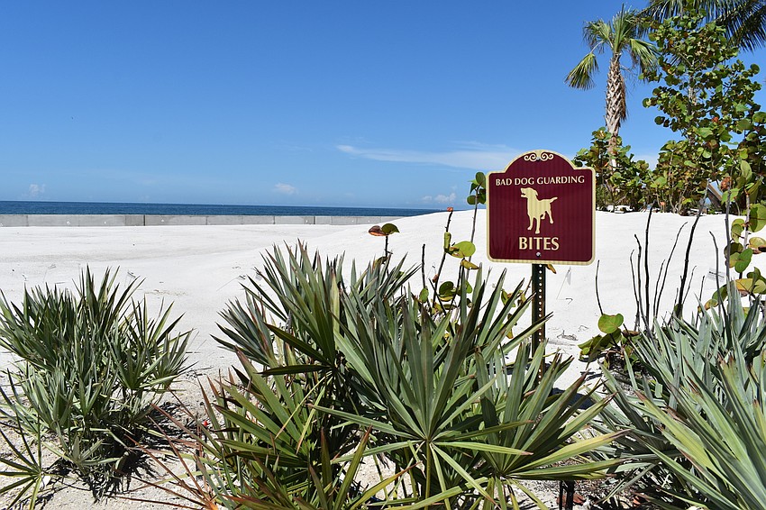 AUGUST: Signs went up near the Ohana property warning of guard dogs.