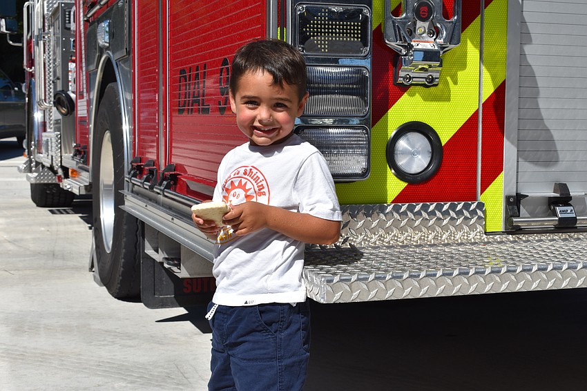 AUGUST: Jimmey Romanoff, 3, was on his way to school when his dad saw the Fire Station 92 grand opening.