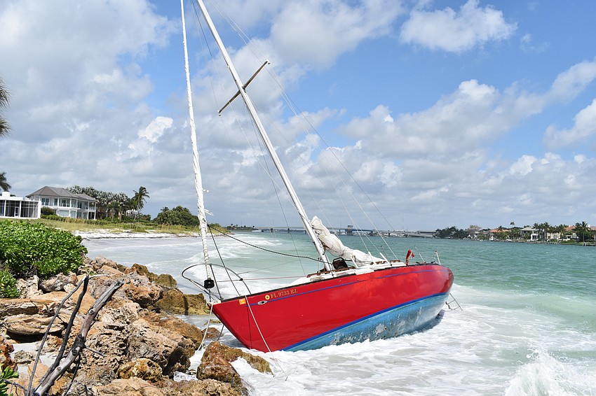 SEPTEMBER:  The sailboat that ran aground near Lighthouse Point remained for months.