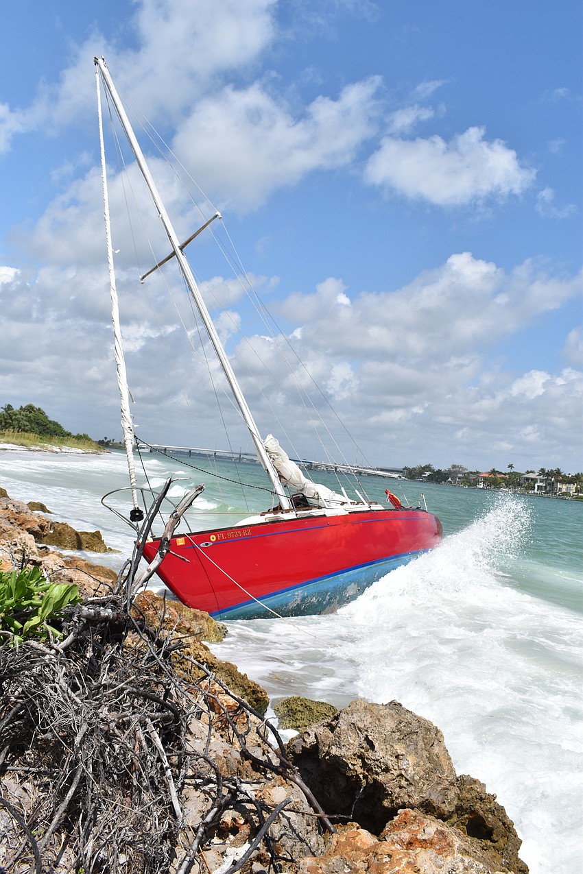 SEPTEMBER: The sailboat that ran aground near Lighthouse Point remained for months.