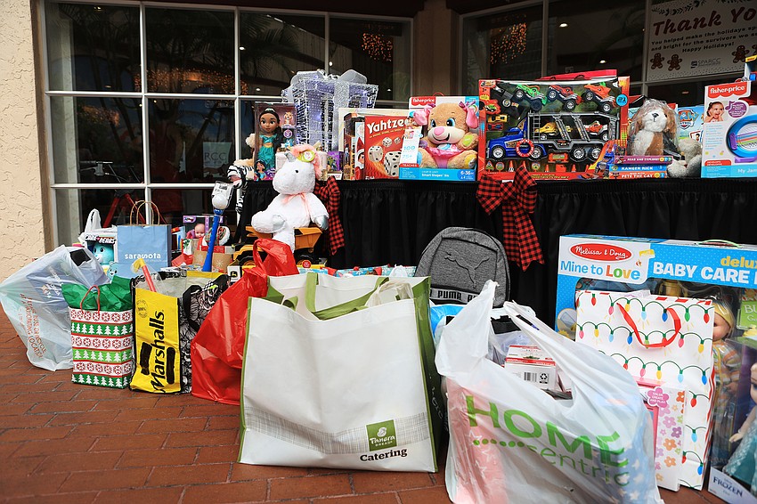 Several guests donated gifts to the Holiday Toy Store.