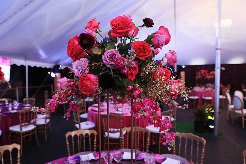 The night's decor has a series of pinks, purples, magentas and teals.
