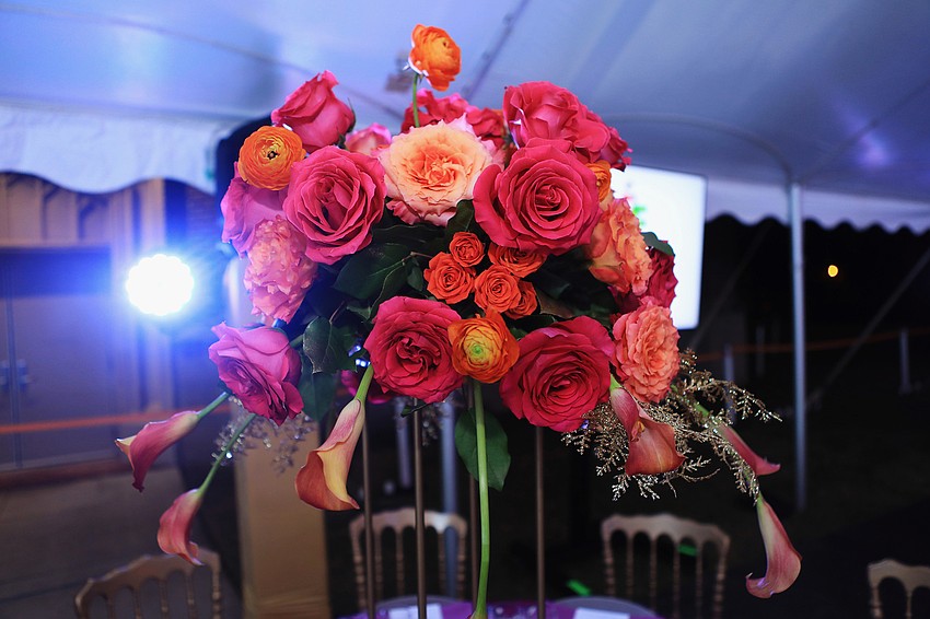 The night's decor has a series of pinks, purples, magentas and teals.