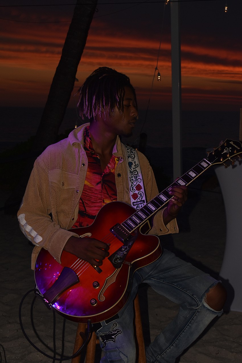 Akiem Esdaile played jazz guitar as the sun set.