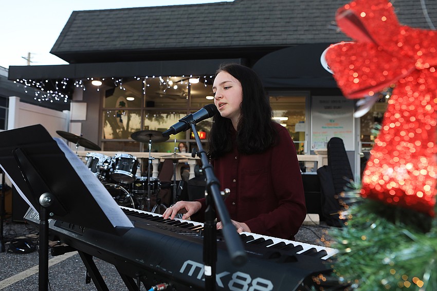 Abigail Flowers regales visitors on her piano