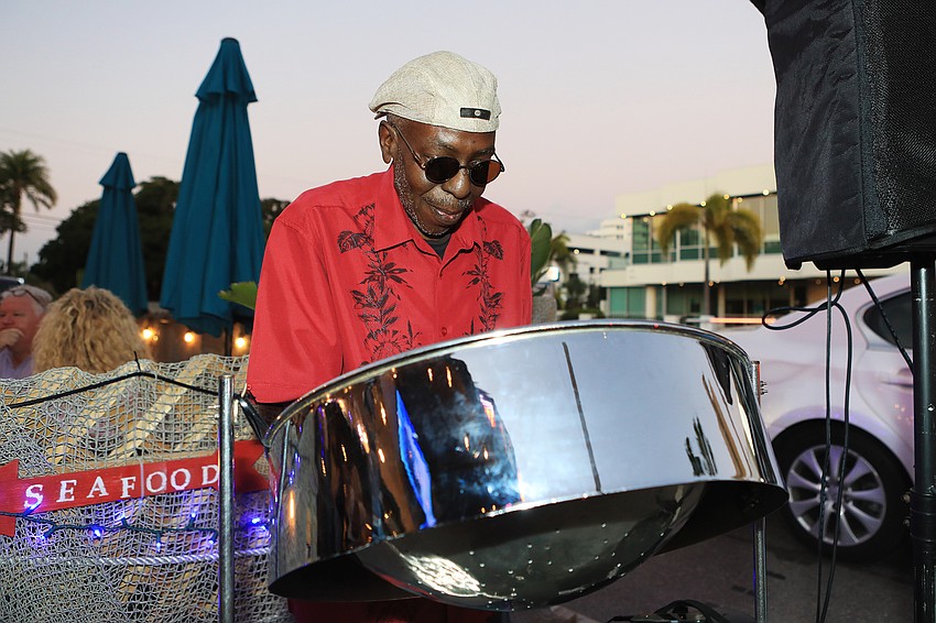 Johnny Lawrery plays the steel drums.