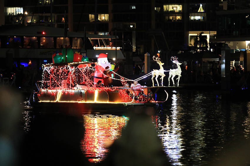 Boats cruise through the Bayfront Park area.