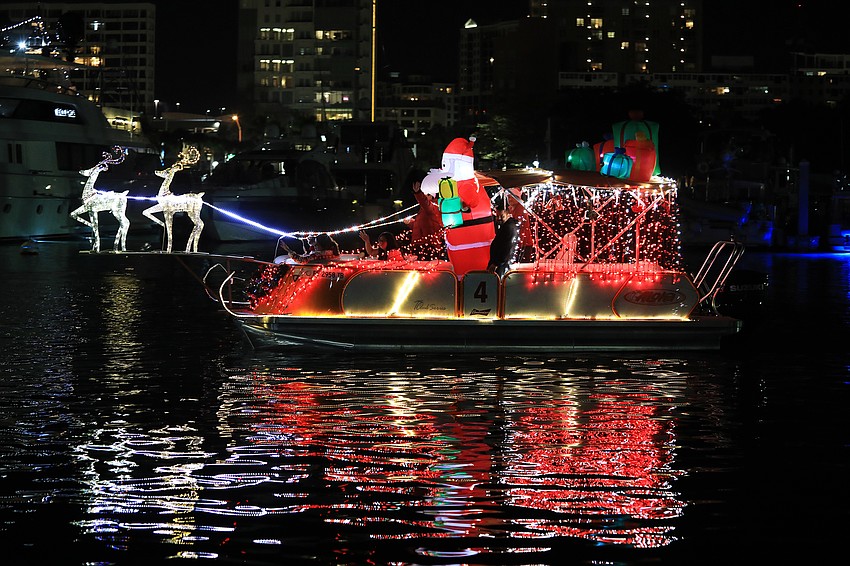 Boats cruise through the Bayfront Park area.