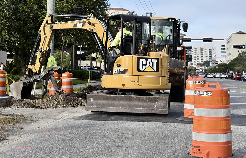Workers in December smoothed over a former rail crossing on Ringling Boulevard and installed a center median and pedestrian signs and alert signals.